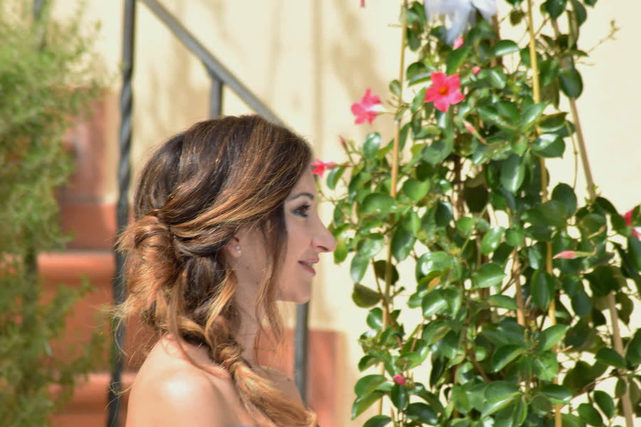 Bride holding her bouquet as she leaves the church